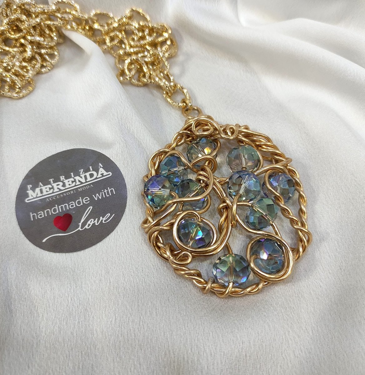 Collana ciondolo rotondo con cristalli boreali